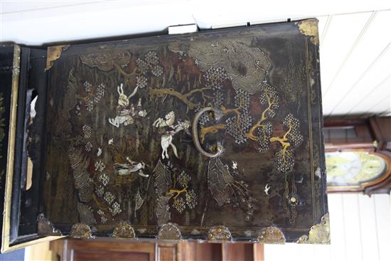 A late 17th century Chinese black lacquer cabinet, overall H. 5ft 3in.